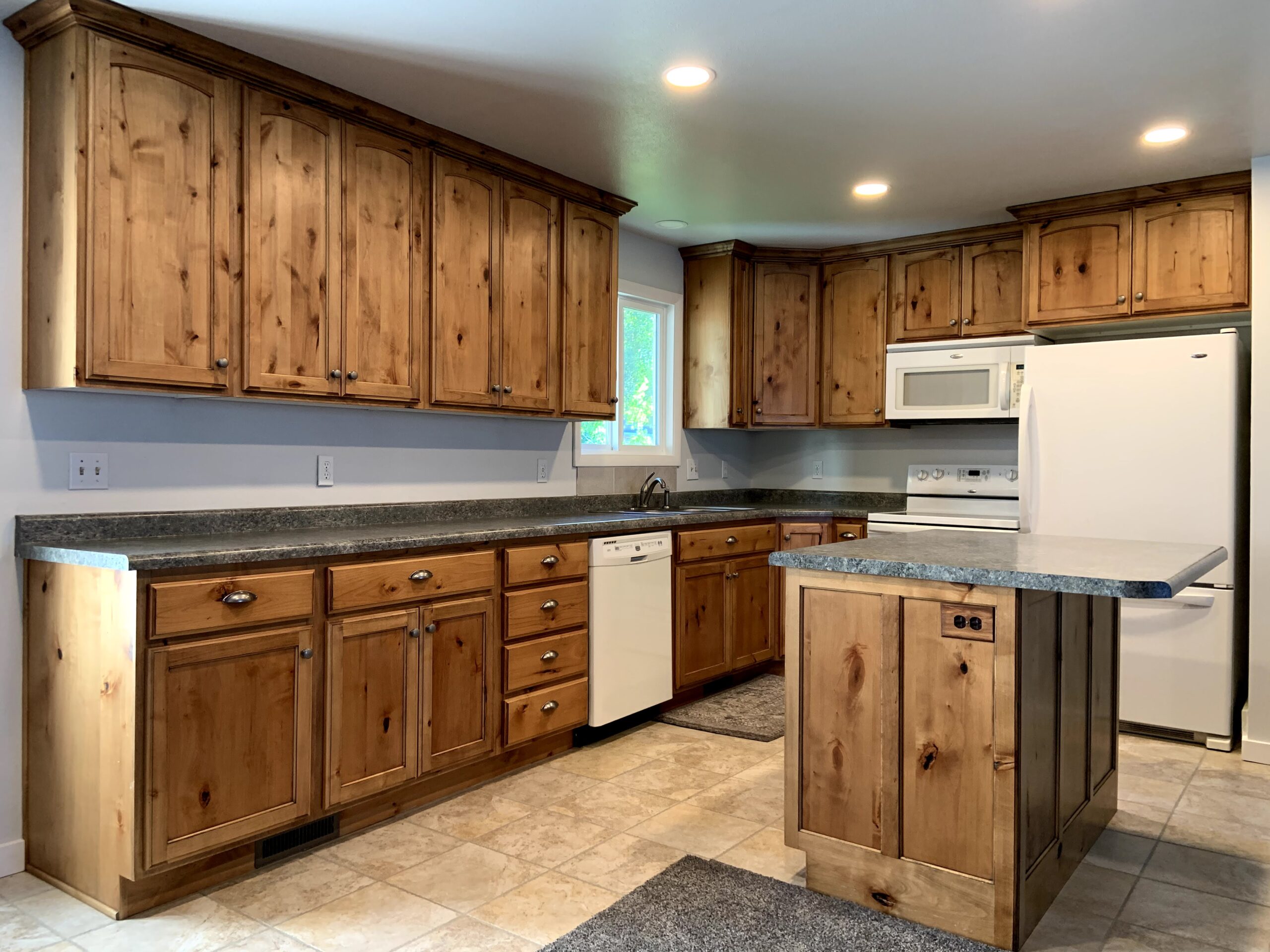 Wide-angle view of knotty wooden cabinets