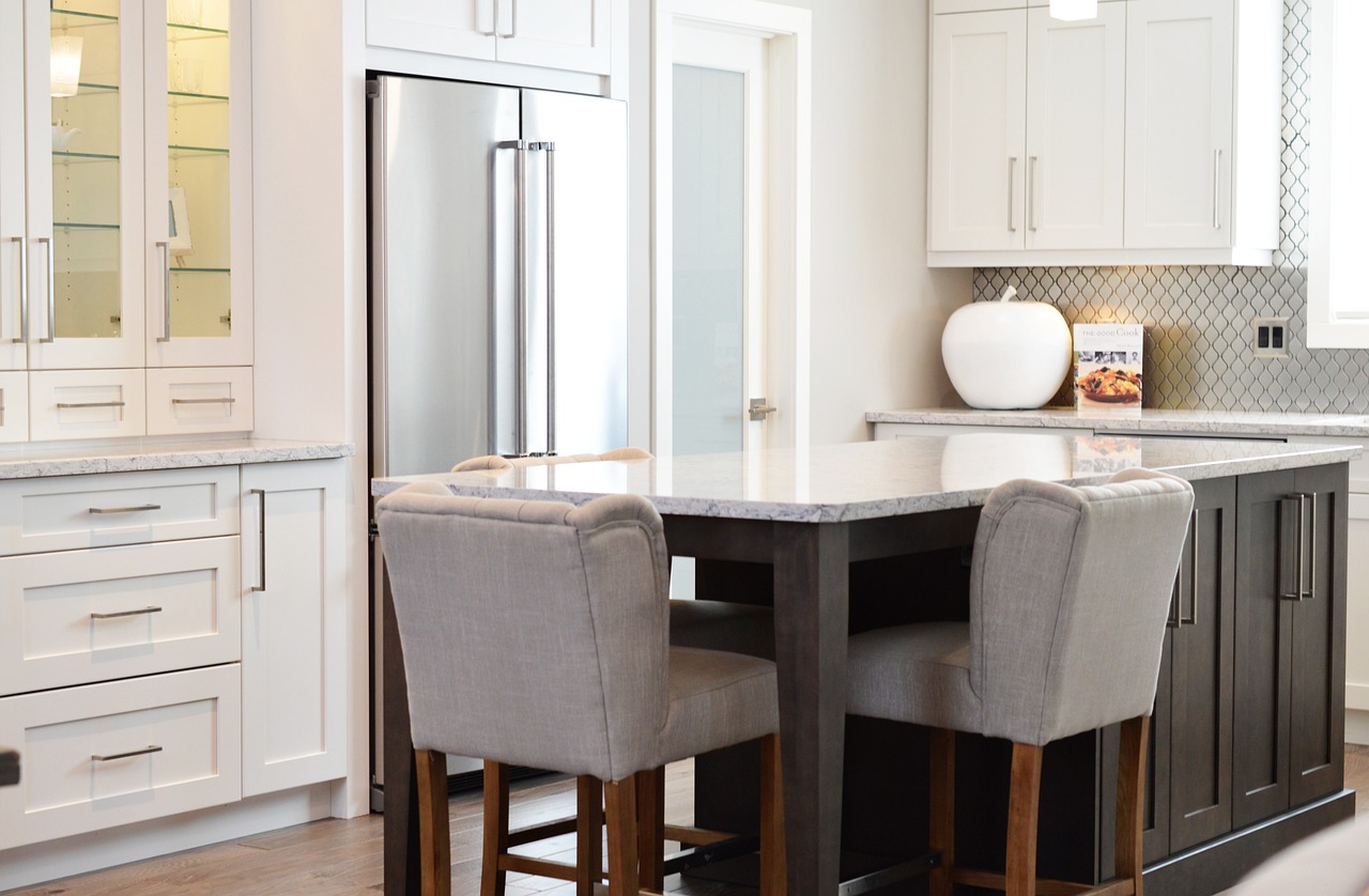 Upscale cabinets in white and gray, with stainless steel appliances